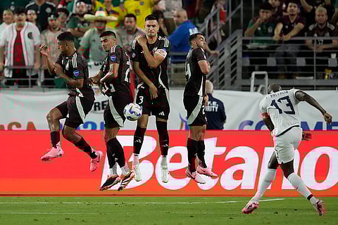 Enner Valencia takes a free kick against Mexico